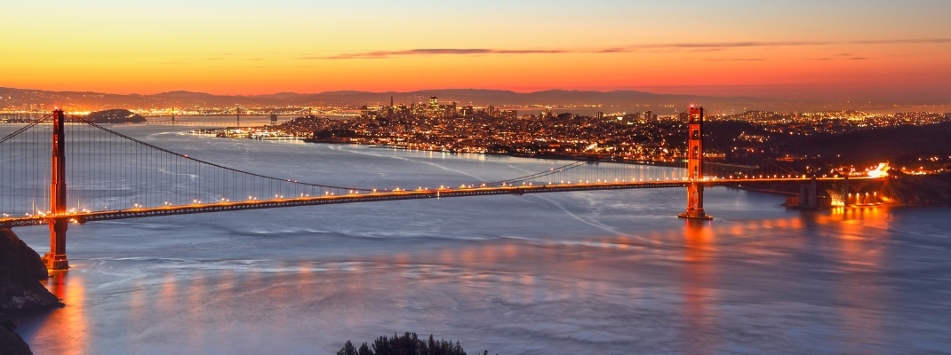 Golden Gate Bridge and skyline of San Francisco at sunrise, California, USA
