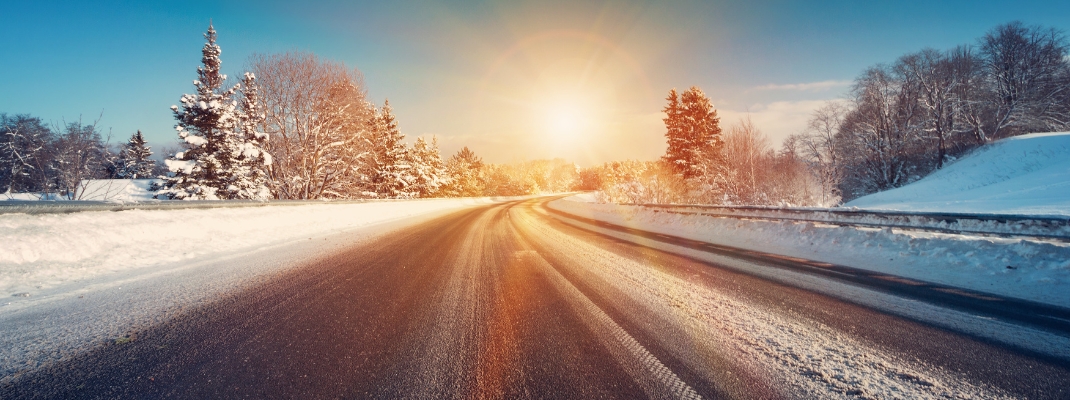 Asphalt road in snowy winter