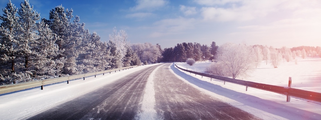 Car on winter road covered with snow