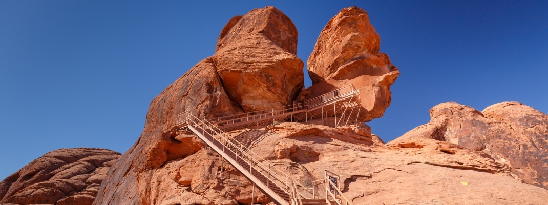 Metal staircase leading to Atlatl Rock with 4000 years old Petroglyphs from Native Americans, in Valley of Fire State Park, Nevada, USA
