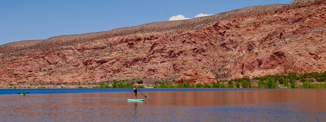 SUP on Ken's lake close to Moab and La Sal Mountains. Utah, USA. High quality photo 