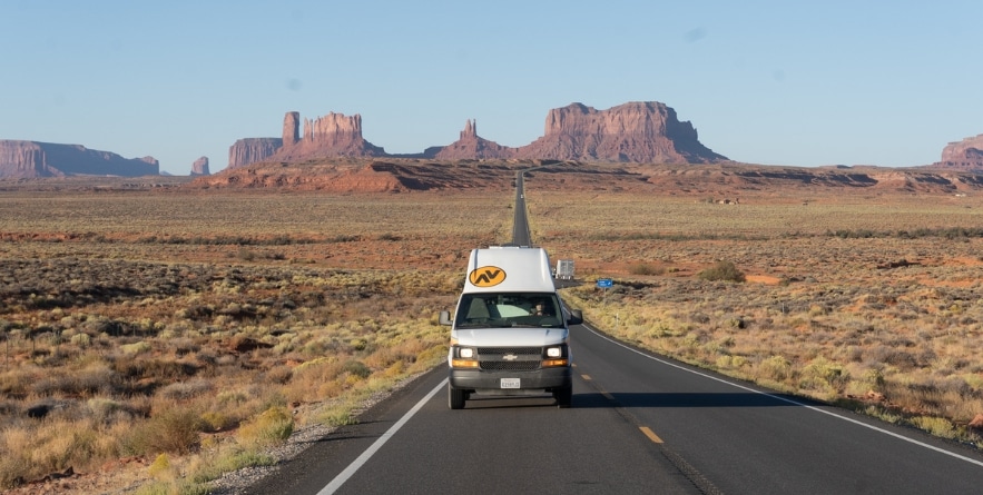 Campervan on road in Monument Vally, USA